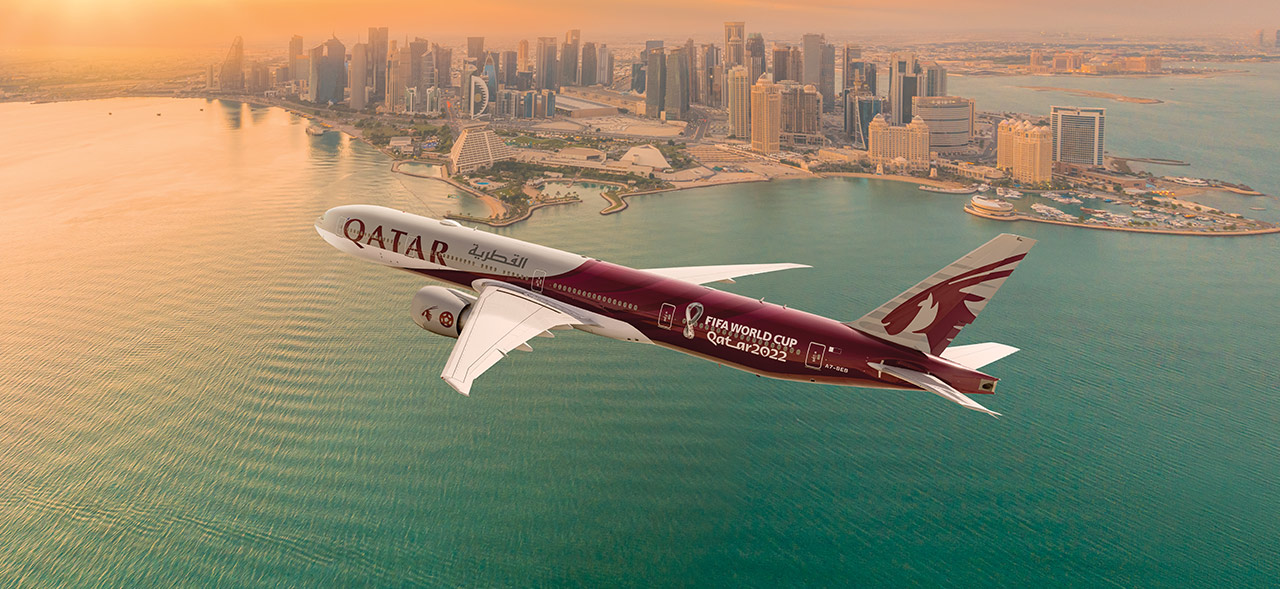 Qatar Airways Airplane Flying over a city