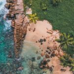Seychelles drone shot of beach cliffs