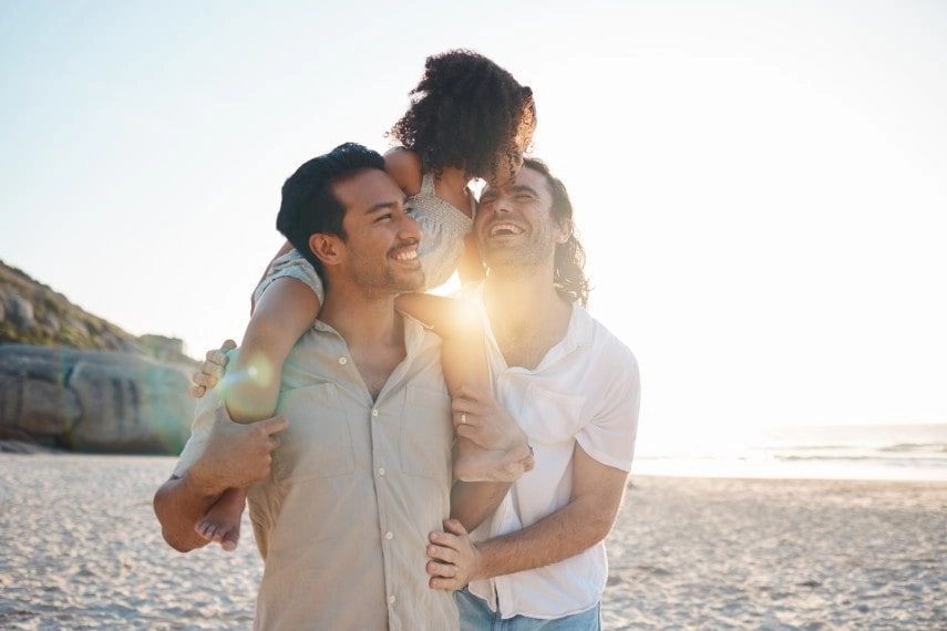 Gay couple at beach, Canada