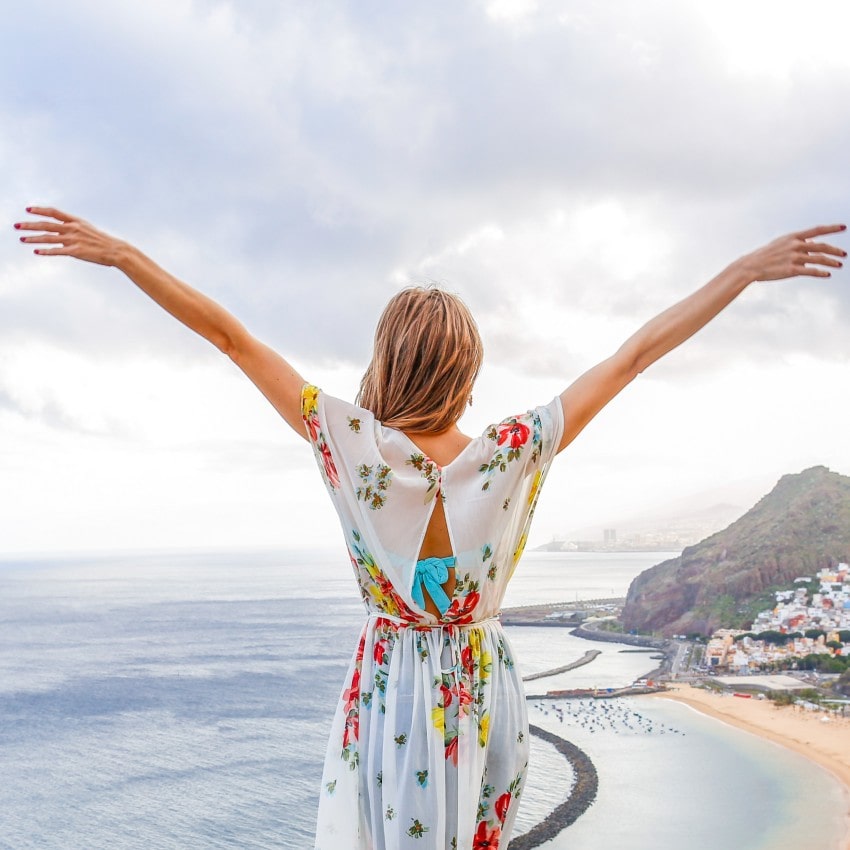 Traveler girl enjoying the beach in Tenerife
