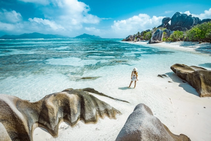 A Girl on Seychelles wearing dress with hat