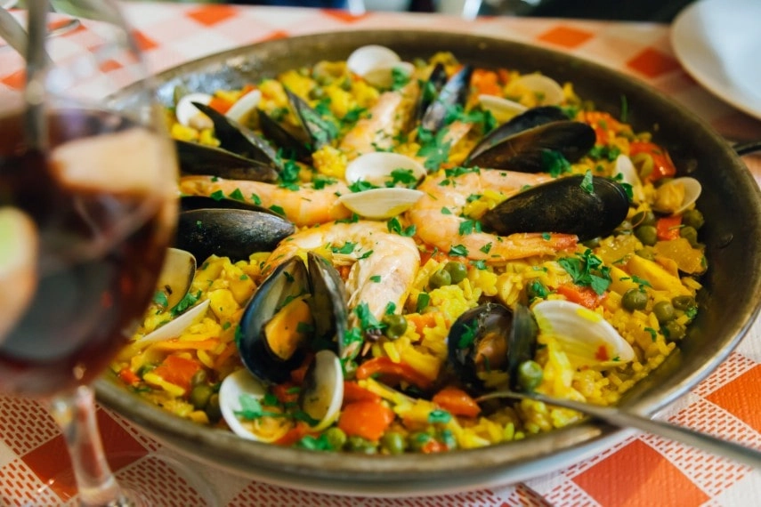 Traditional Spanish paella dish to eat in August
