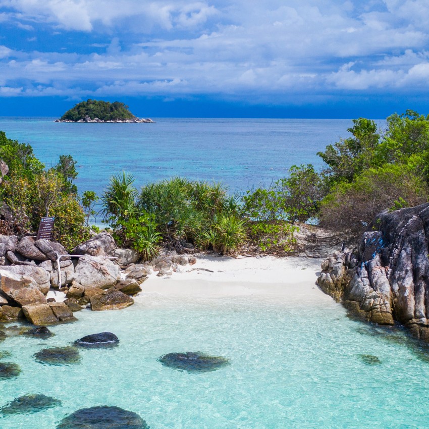 kayak in crystal clear lagoon in Thailand