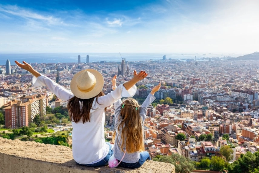Mother daughter enjoying at skyline of Barcelona, Spain