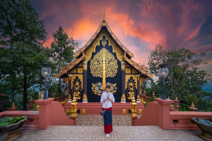 Asian girl tourist in Wat Phra That Doi Phra Chan in Thailand