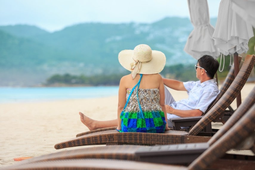 couple relaxing at chaweng beach in koh samui