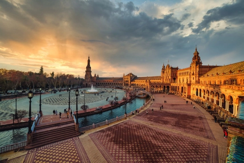 scene of Plaza España in Seville at sunset