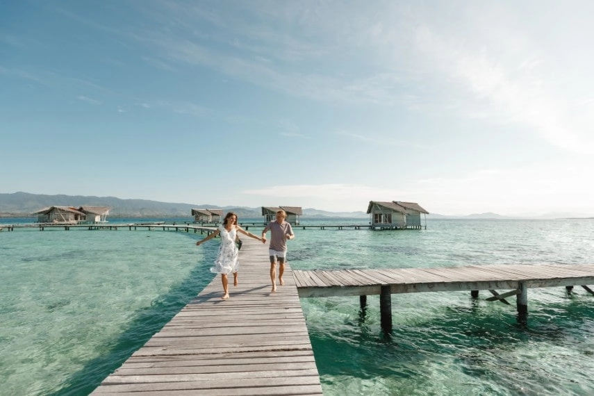 A happy couple in beautiful outfits in Maldives in December