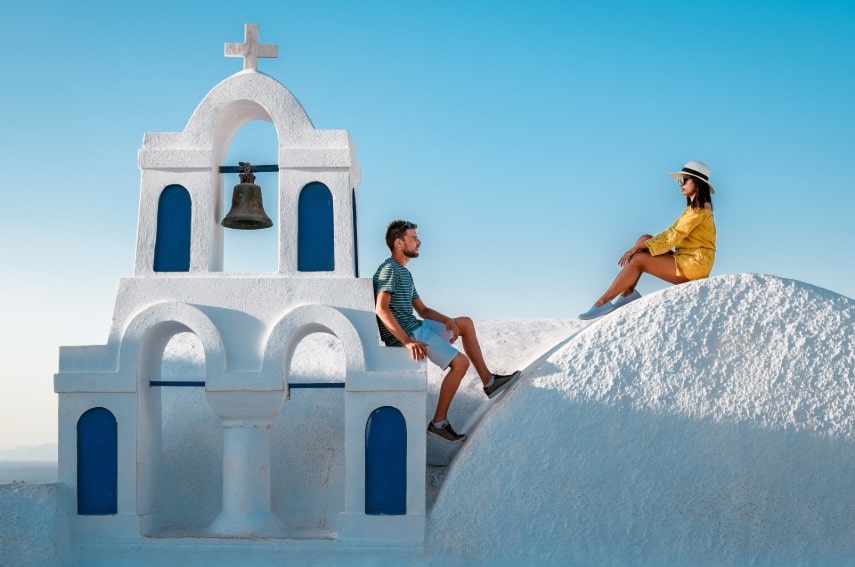 young couple in Greece wear warm outfits in December