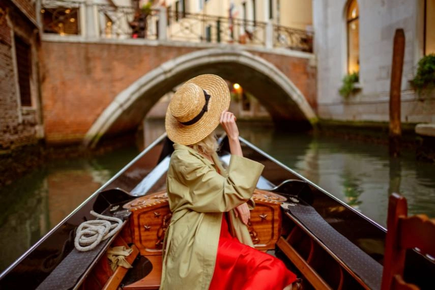 Gondola ride along beautiful street in Venice, Italy