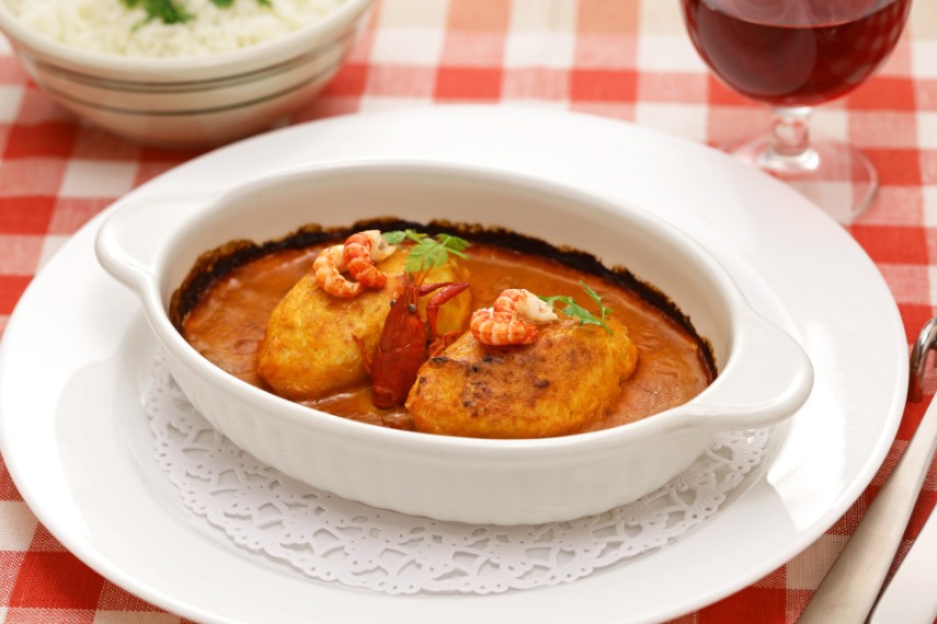 Eat Quenelle de Brochet (fluffy fish dumplings with creamy crayfish sauce ), French Lyonnais cuisine