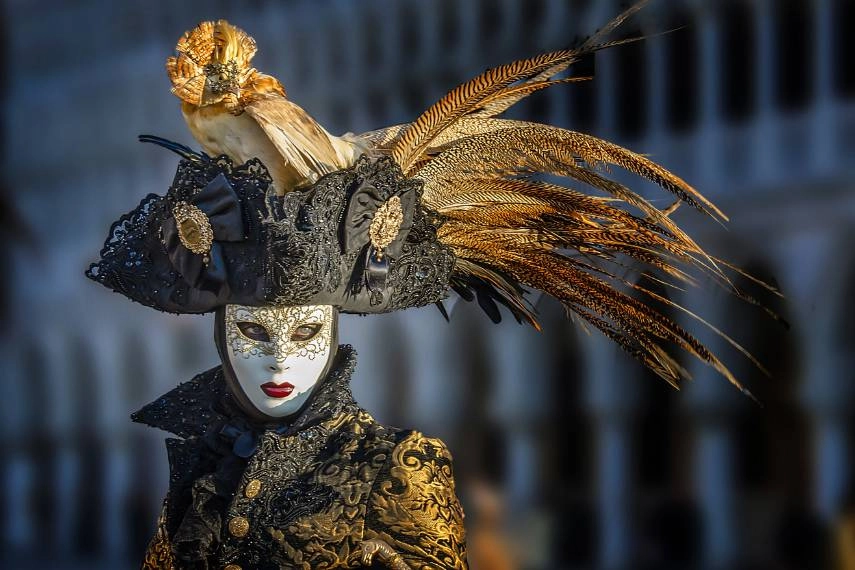 a female wearing black dresses for the Carnival of Venice