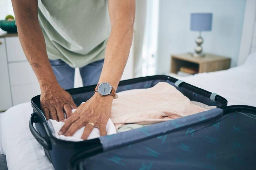 packing suitcase in home for trip to Venice