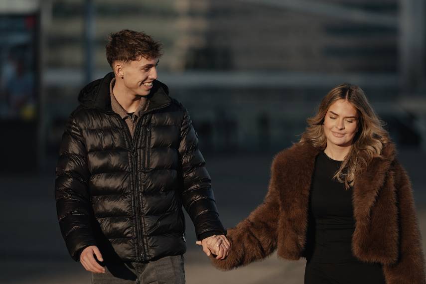 Romantic Couple is Wearing Casual Dresses, Puffer Jacket and Walking in Rome