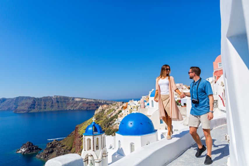 Young couple walking on Santorini
