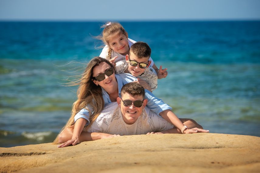 joyful family of four in Malta
