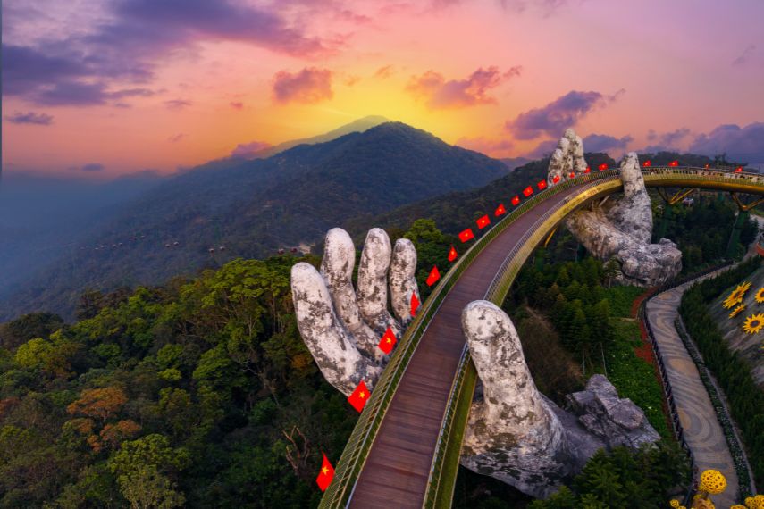 Aerial view Golden bridge at sunset in Ba Na Hills Two Hands, Da Nang Vietnam