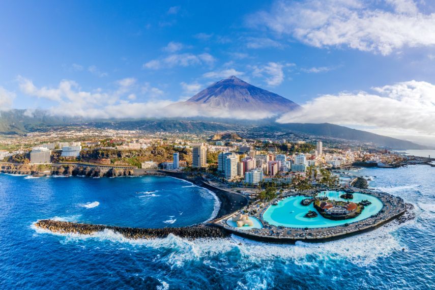 Aerial view with Puerto de la Cruz, in background Teide volcano, Tenerife island