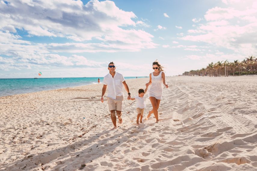 Happy family on the beach in Cancun