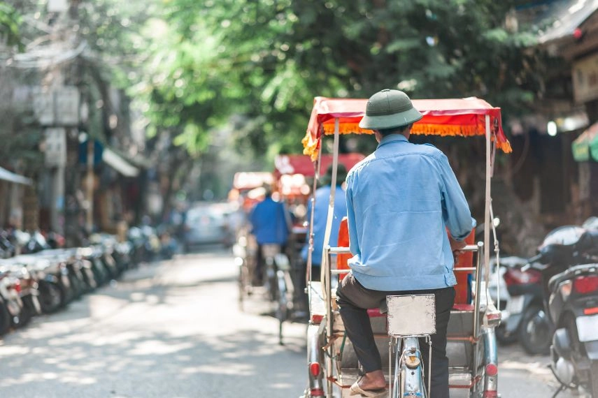 Traditional cyclo ride down the streets of Hanoi, Vietnam