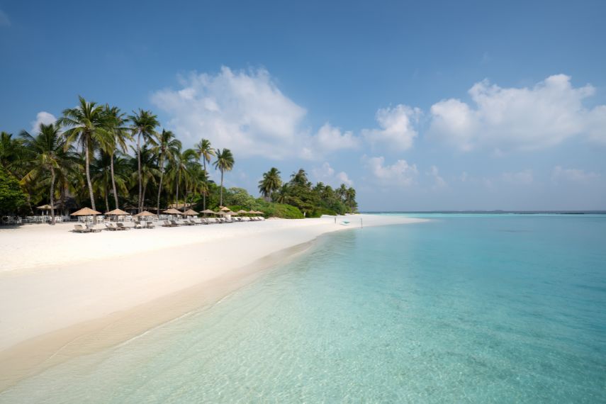 turquoise water and sandy beach at a resort in noonu atoll maldives