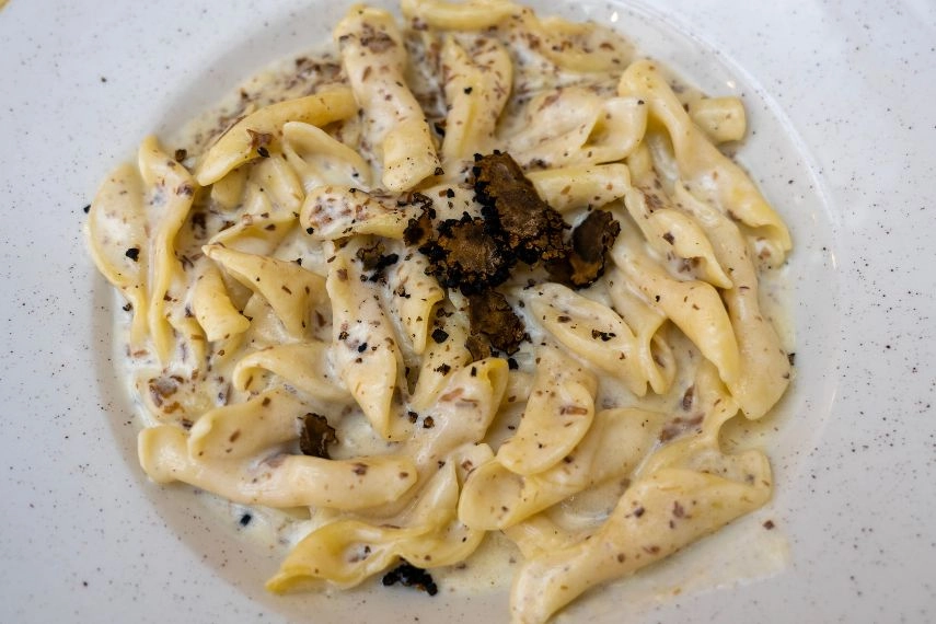 fuzi istrian pasta with black truffle tartufo mashroom and cream traditional food in Rovinj Croatia