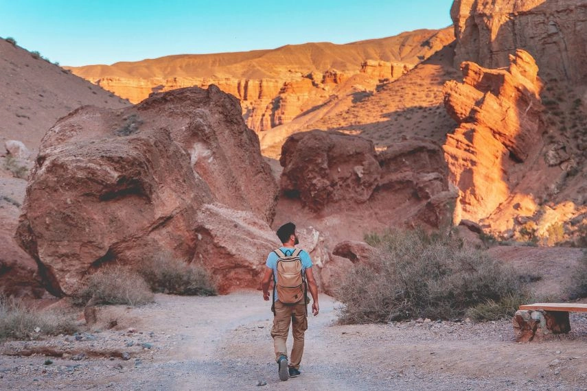 Man walking through the Charyn canyon near Almaty city, Kazakhstan