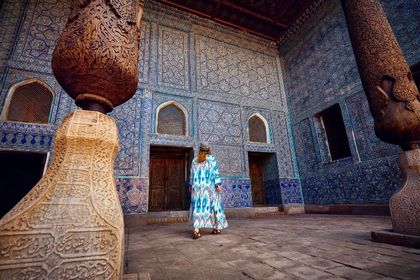 Woman tourist at old city Khiva in Uzbekistan